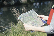 Libby looking at map of farm