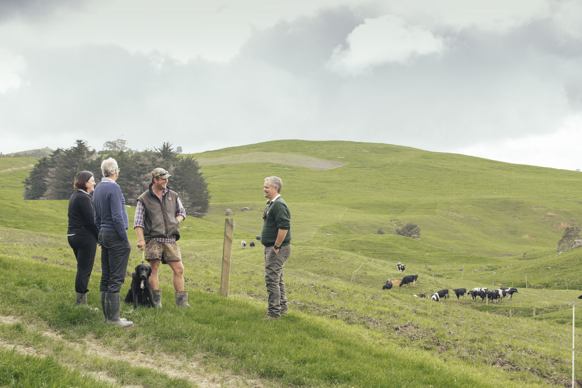 Dion, Tim, Sarah talking with landowner